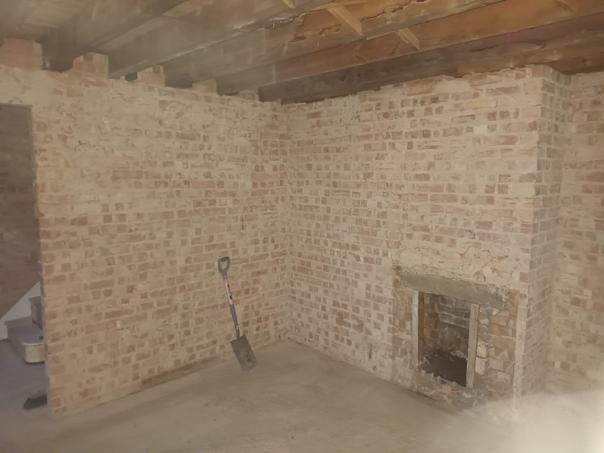 Strip-out project after — exposed brickwork ready for refurbishment